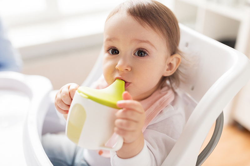 baby at risk for decay drinking from a sippy cup bottle