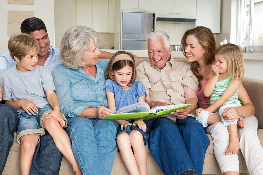 Multigenerational family reading together.