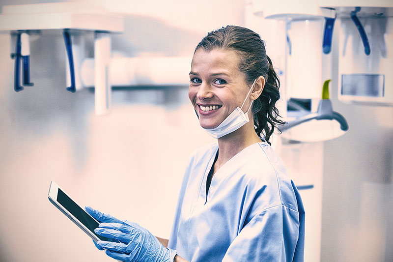 Dental hygienist smiling in a dental office