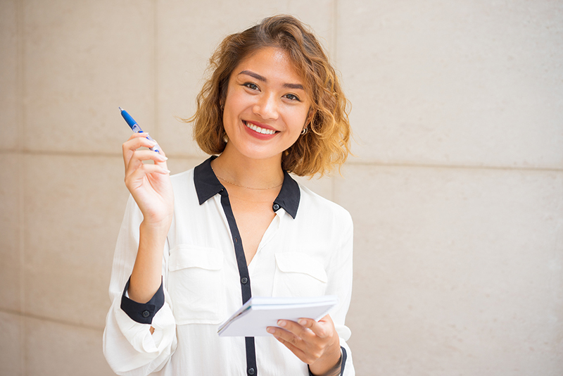 womant taking notes about dental implants